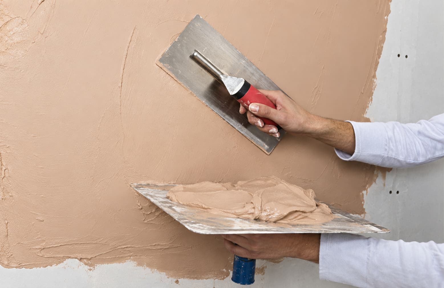 AI-enhanced illustration of hands applying plaster with a finishing trowel and hawk.