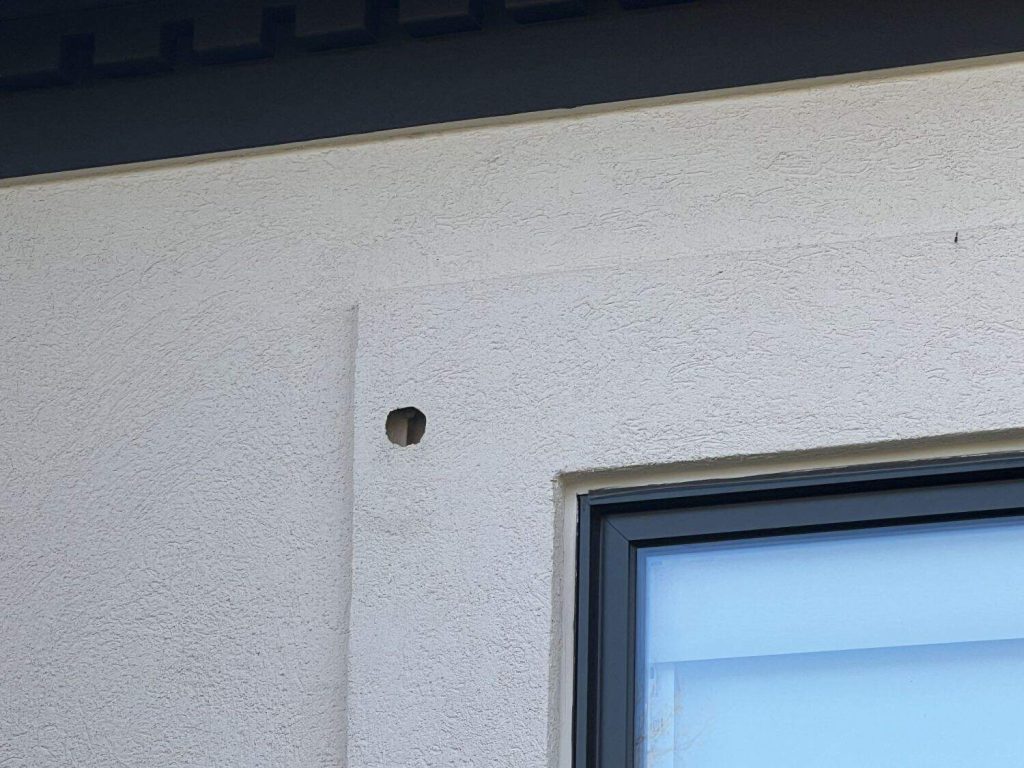 Woodpecker_Holes_-_EIFS_Repair_Needed
